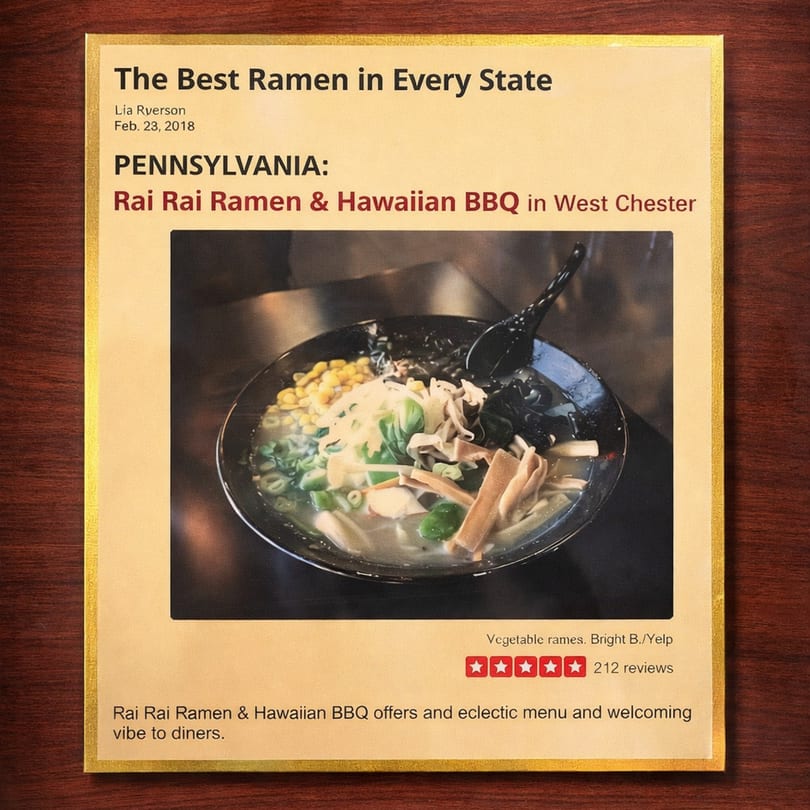 A framed article featuring a close-up of a vegetable ramen bowl from Rai Rai Ramen & Hawaiian BBQ.