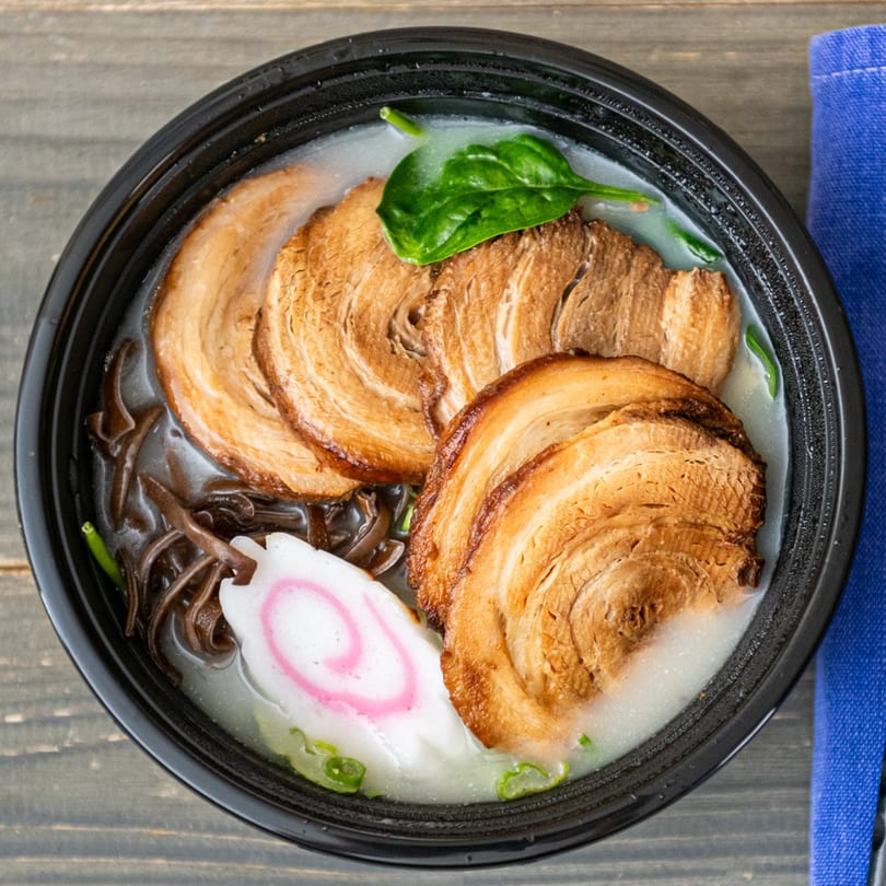 Rai Rai Ramen's tonkotsu ramen with pork belly, fish cake, spinach, and wood ear mushrooms.